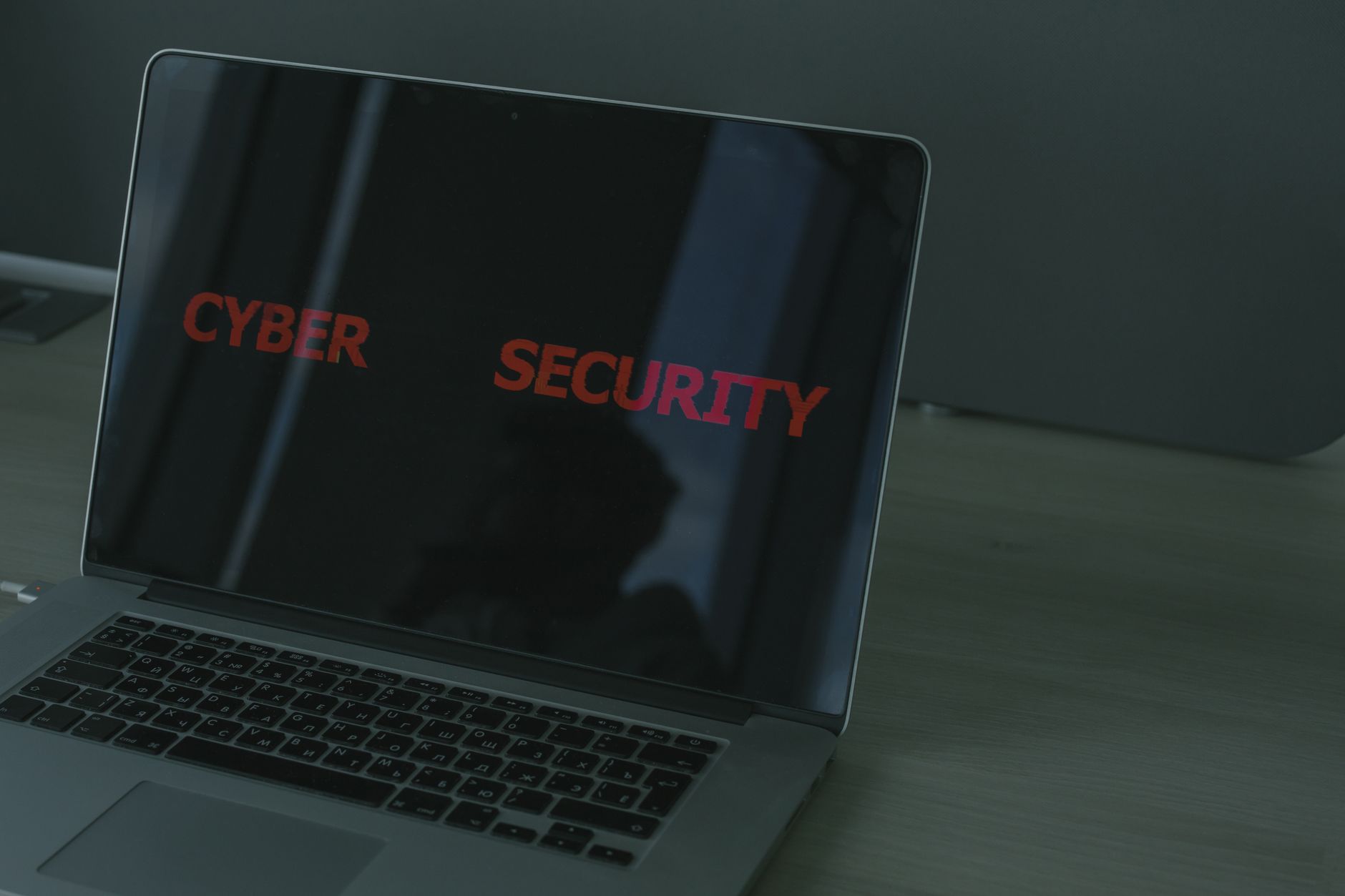 Operator guide open beside a secured laptop