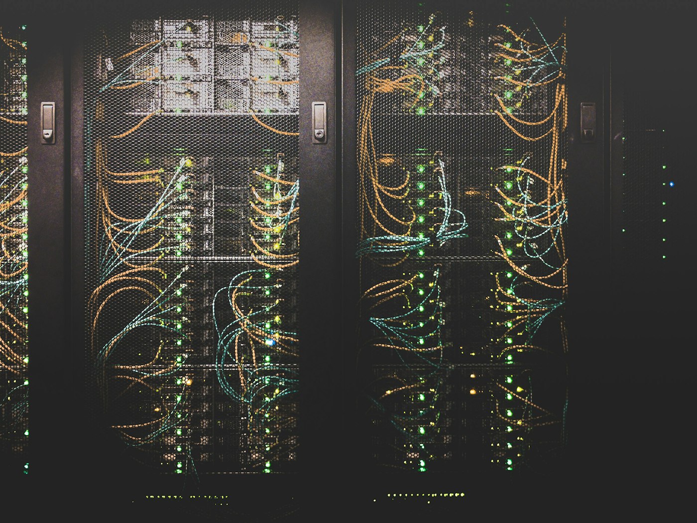Server room aisle with illuminated racks