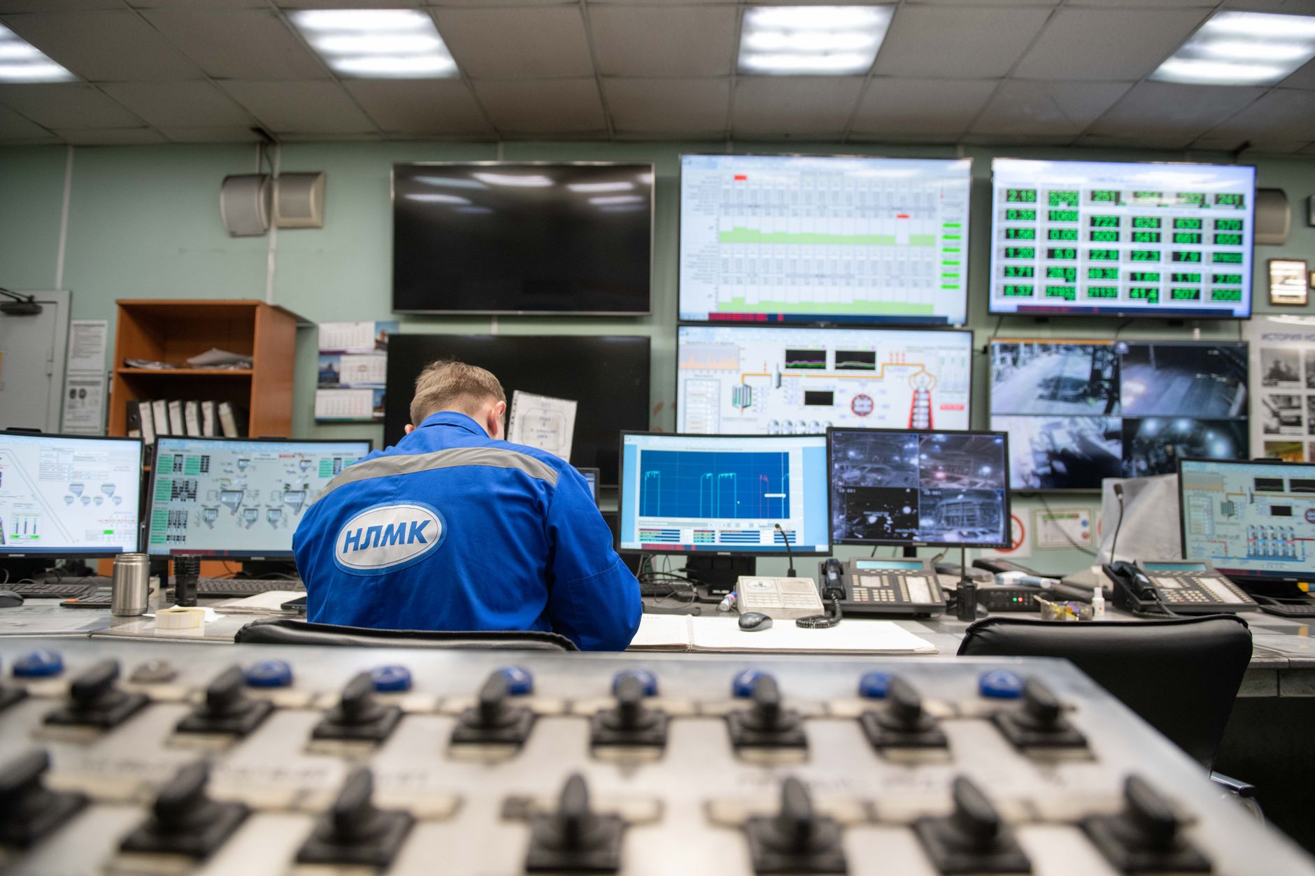 Security operations center with a wall of monitoring screens