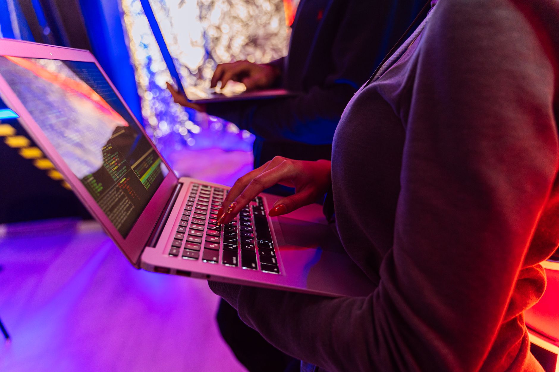 Cybersecurity strategy session with notes and laptops